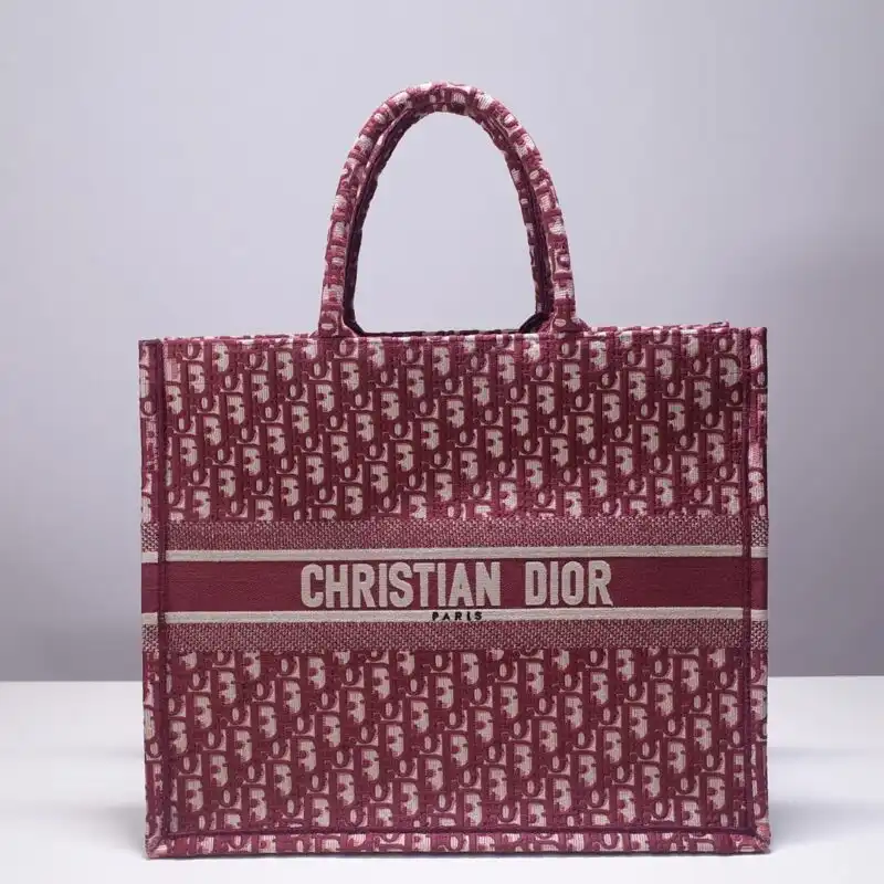 Discover the elegance of the Dior Tote Book in a vibrant red print. A perfect companion for your stylish journeys! ❤️👜✨ https://tinyurl.com/25nsxn3l