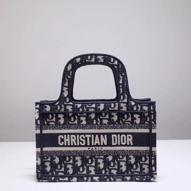 Discover elegance with the Dior Tote Book Mini CD in classic black. A timeless companion for every occasion! 🖤✨👜 https://tinyurl.com/248h976k