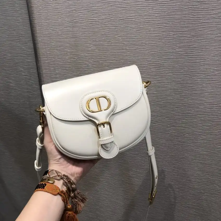Discover the elegance of the Dior Bobby White. A timeless piece that radiates grace and charm, perfect for any occasion. ✨🤍👜 https://tinyurl.com/2by8jjdx