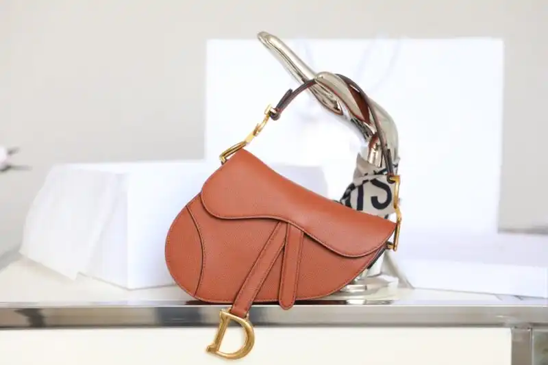 Discover the timeless elegance of the Dior Saddle Bag in brown. A perfect blend of style and sophistication for every occasion! ✨👜❤️ https://tinyurl.com/27xxp9cz
