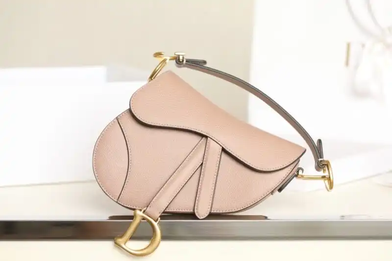 Discover the elegance of the Dior Saddle Bag in soft nude. A perfect blend of style and charm for any occasion. 💖🌸✨ https://tinyurl.com/225nex8j