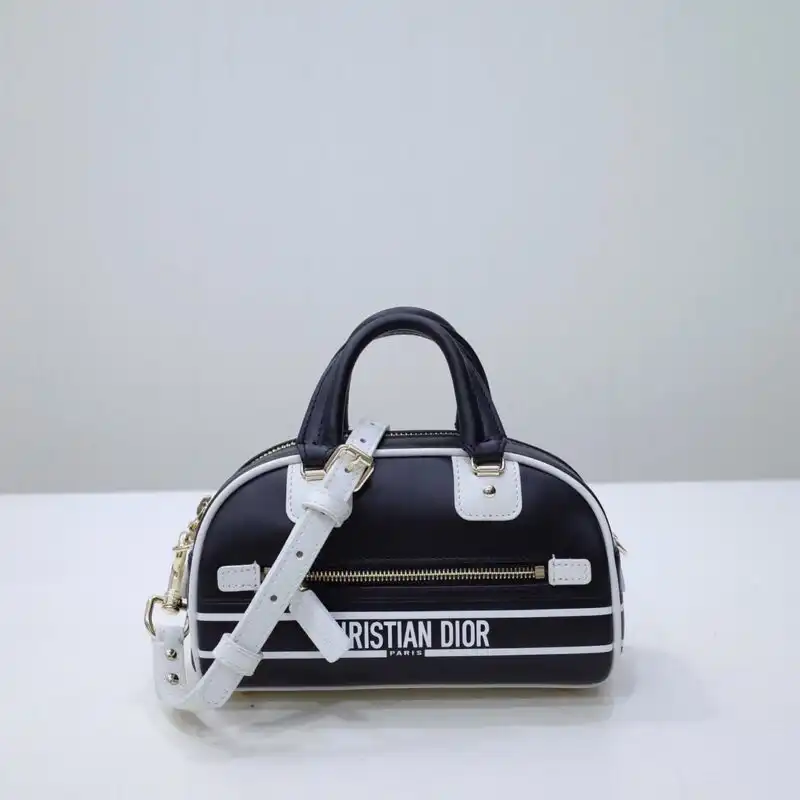 Discover the elegance of the Dior Vibe Zip Bowling Bag in classic black. A timeless companion for every journey! 🖤✨👜 https://tinyurl.com/242mwxoj