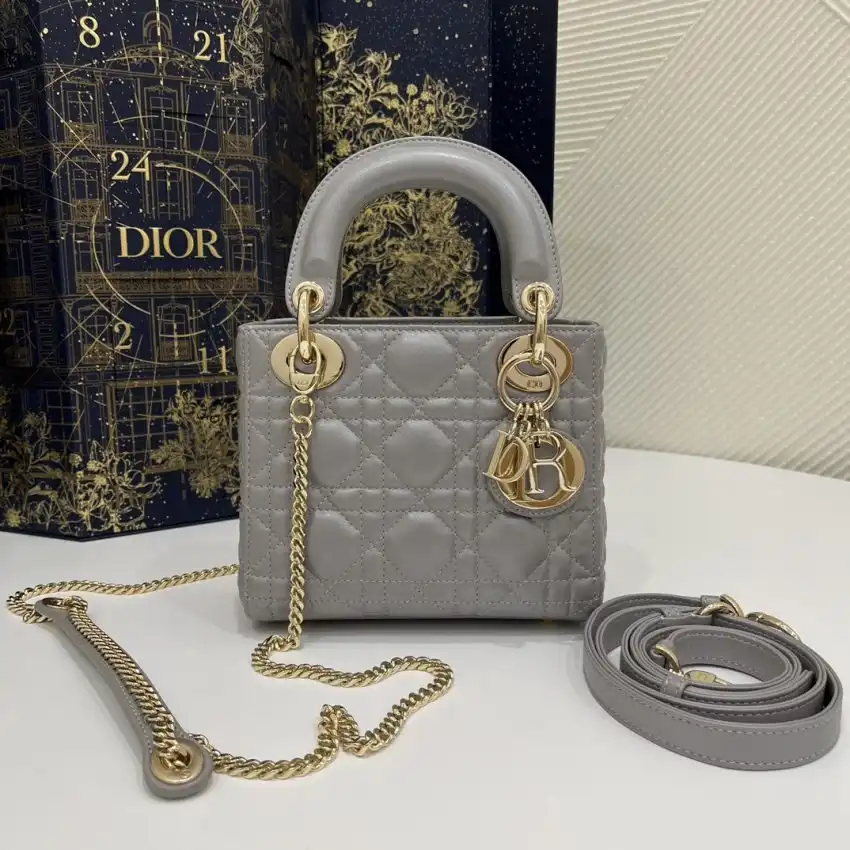 Discover the elegance of the Lady Dior Mini in a soft grey, beautifully accented with silver. A timeless companion for every occasion. ✨💖👜 https://tinyurl.com/28mz4t6g