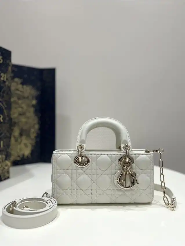 Discover the elegance of the Dior Lady D-Joy Bag in white. Perfect for every occasion, it adds a touch of grace to your style. ✨🤍✨ https://tinyurl.com/2dfmktaq
