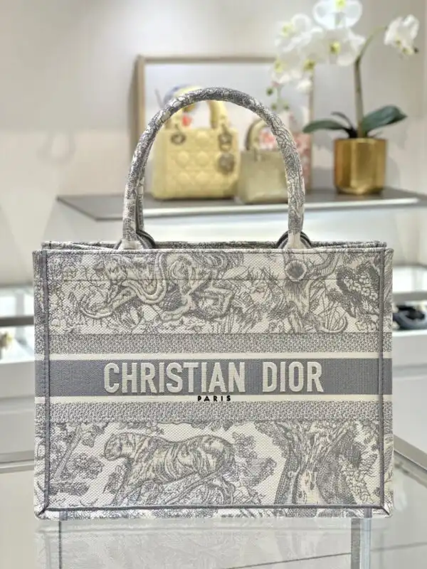 Discover the elegance of the Dior Tote Book Tiger in Grey. Perfect for every occasion, it’s a gentle reminder of beauty. 🐅💖✨ https://tinyurl.com/2yn4ppcd