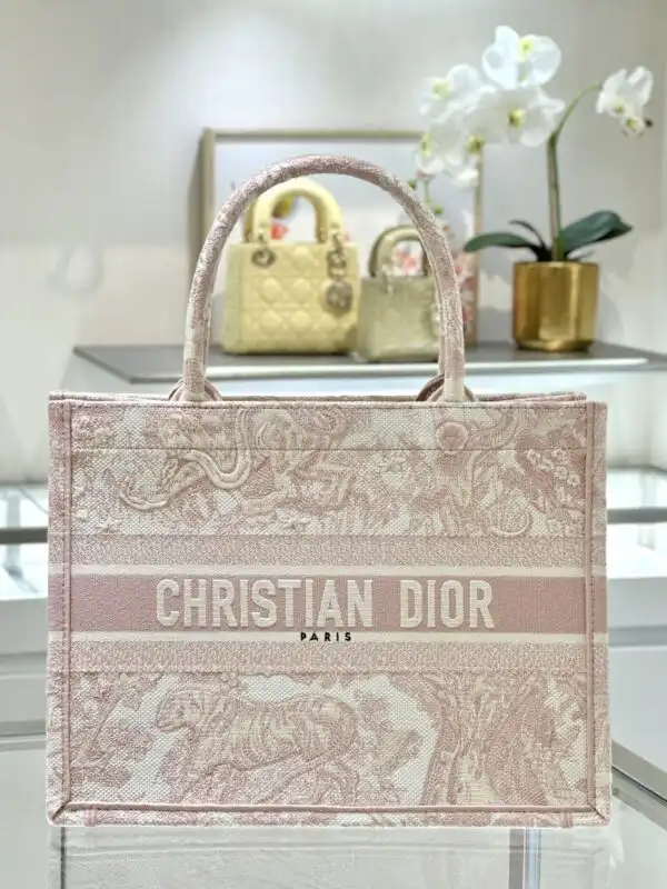 Embrace elegance with the Dior Tote Book in Pink Tiger. 🐅🌸 Perfect for carrying your essentials with style and grace. ✨💕 https://tinyurl.com/2y65286b