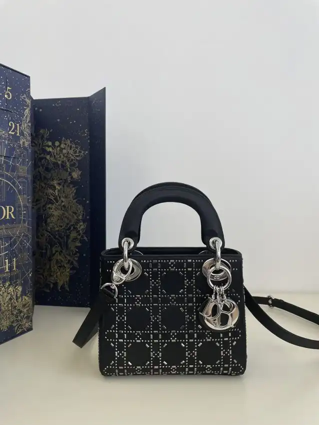 Discover the timeless elegance of the Lady Dior Mini Satin in black. A delightful companion for any occasion! ✨🖤💖 https://tinyurl.com/286d6oew