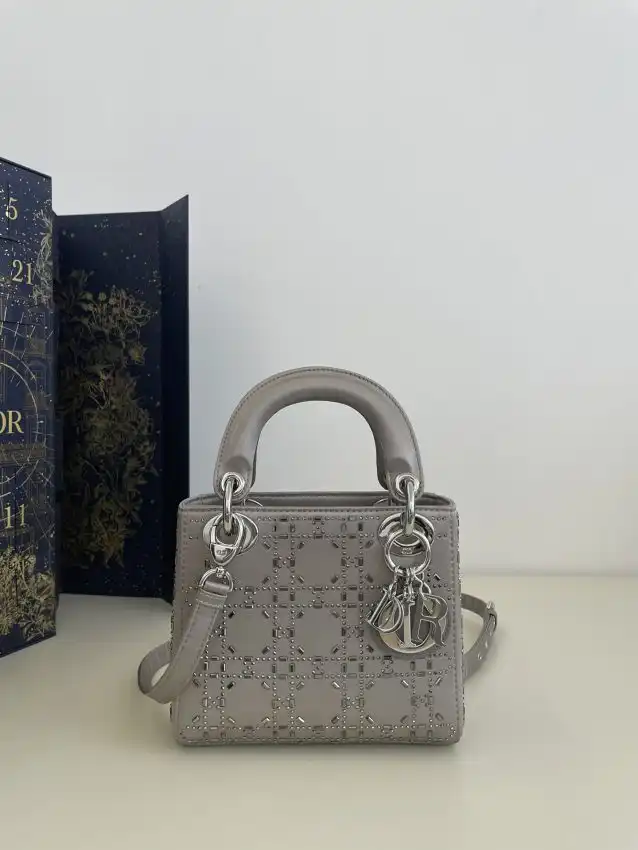 Discover the elegance of the Lady Dior Mini in soft grey satin. A timeless companion for your cherished moments. 💖✨👜 https://tinyurl.com/28q75lbp