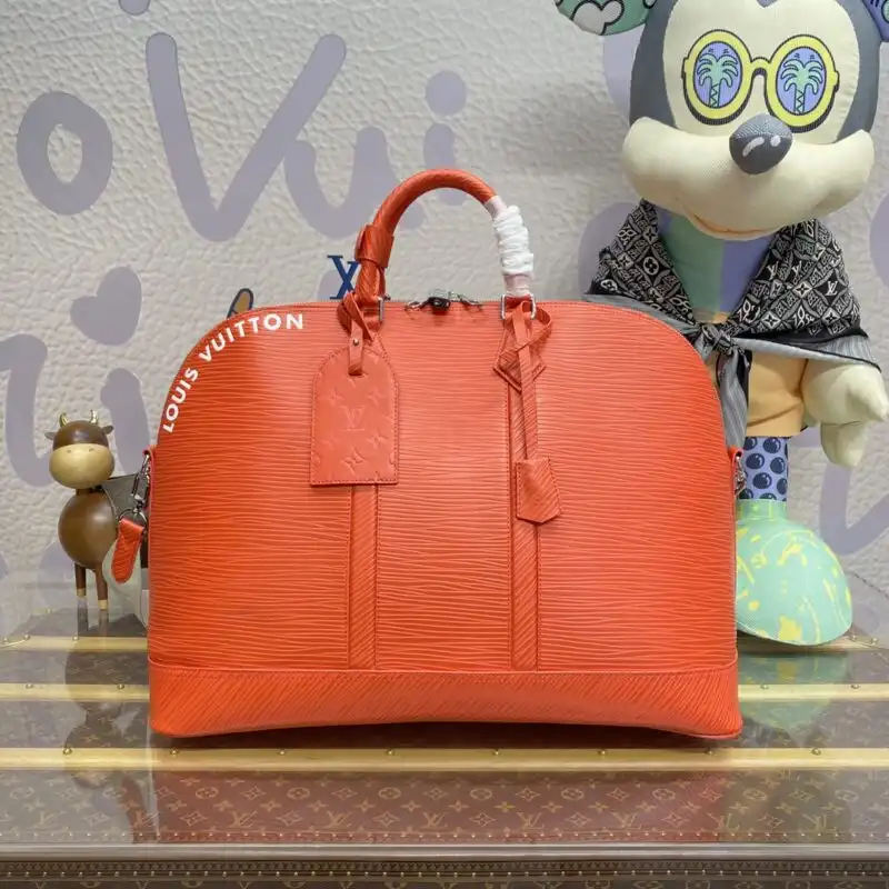 Discover the elegance of the Louis Vuitton Alma Travel GM in vibrant orange. Perfect for your adventures! ✈️👜✨ https://tinyurl.com/24tr4cp2