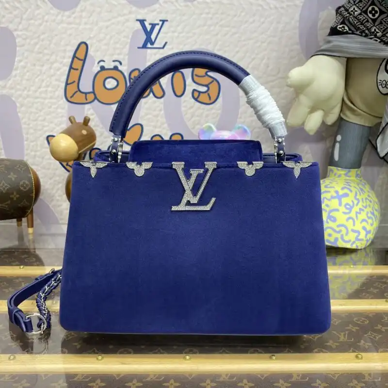 Discover the elegance of the Louis Vuitton Capucines in exquisite blue velvet. A timeless piece that adds a touch of luxury to your style. 💙✨👜 https://tinyurl.com/272tbxac