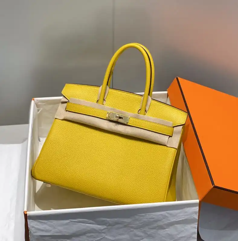 Discover the timeless elegance of the Hermes Birkin in Amber Yellow. A perfect blend of luxury and warmth. ✨💛👜 https://tinyurl.com/23wj4mrs
