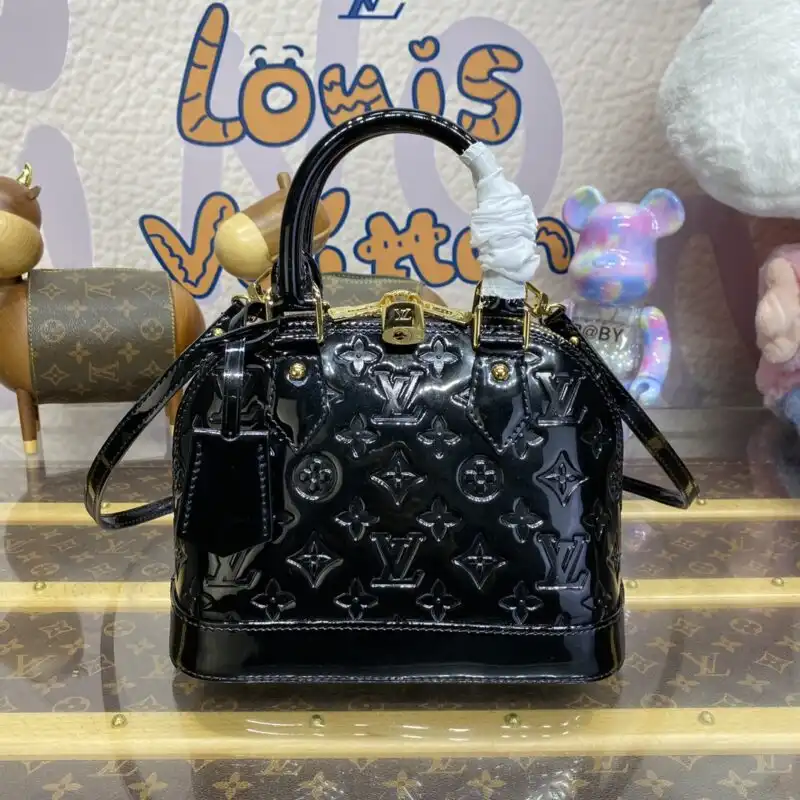 Elevate your style with the timeless elegance of the Louis Vuitton Alma BB in stunning black patent. A touch of luxury! 🖤✨👜 https://tinyurl.com/22qrlkgn