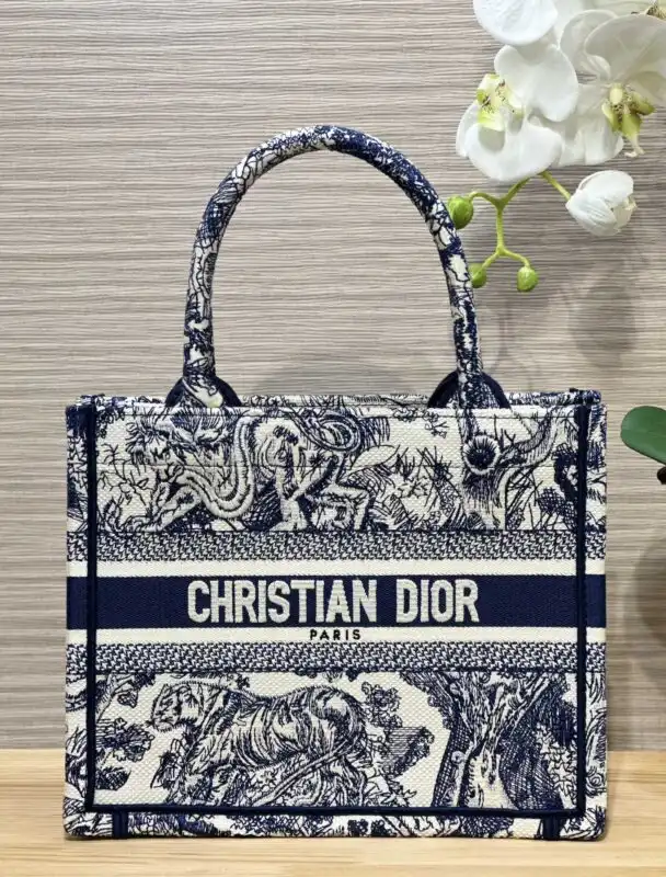 Embrace elegance with the Dior Tote Book in Blue Tiger. Perfect for any occasion, it combines beauty and versatility effortlessly. 🐅💙✨ https://tinyurl.com/27w3hz5l