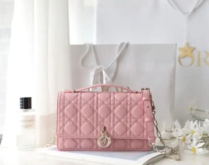 Embrace elegance with our Dior Top Handle Bag in soft pink. Perfect for any occasion, it’s a timeless treasure! 🌸✨💕 https://tinyurl.com/26vuzxku