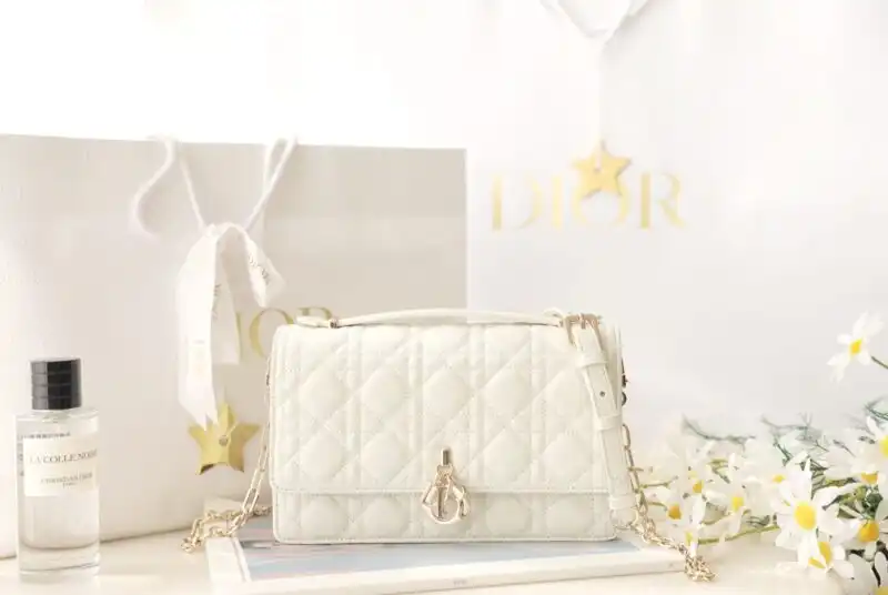 Elevate your style with the enchanting Dior Top Handle Bag in white. Timeless elegance meets gentle sophistication. 🌼✨👜 https://tinyurl.com/2a5qovu9