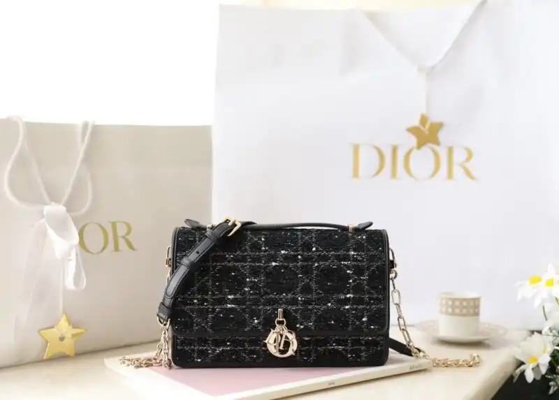 Experience elegance with the Dior Top Handle Bag in black canvas. Perfectly chic for any occasion. 🌟👜✨ Embrace timeless style! https://tinyurl.com/2bnfhjnr