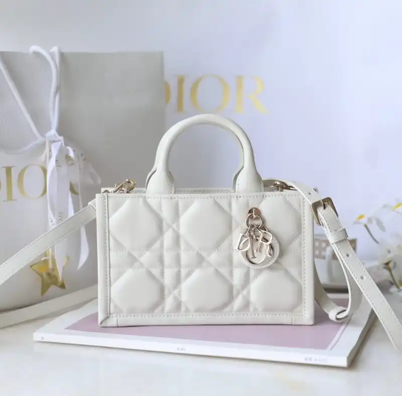 Discover elegance with the Dior Tote Book Mini in white. Perfect for any occasion, it’s a delightful blend of style and charm. ✨👜💖 https://tinyurl.com/22p7nakg