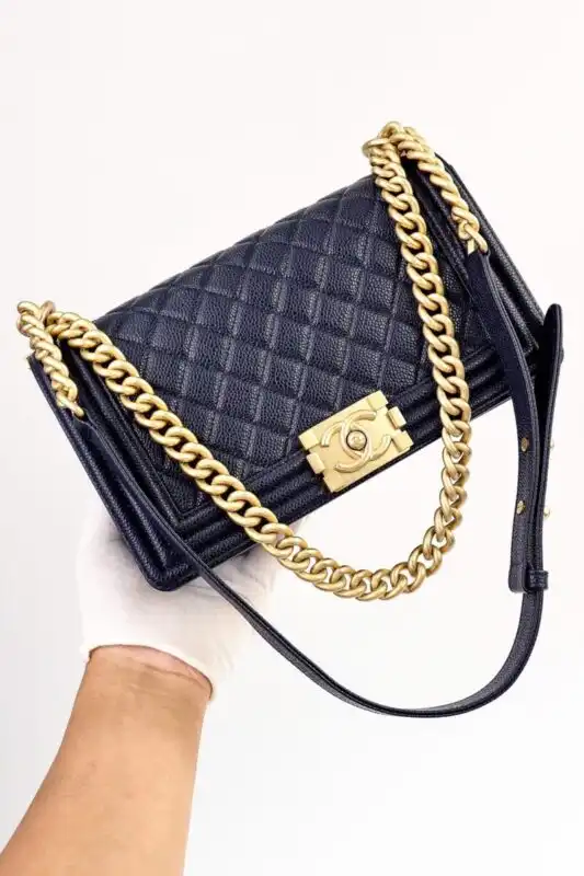 Discover the elegance of CHANEL Le Boy in Dark Blue. A timeless companion that adds a touch of sophistication to every outfit. 💙✨👜 https://tinyurl.com/26p96jlh