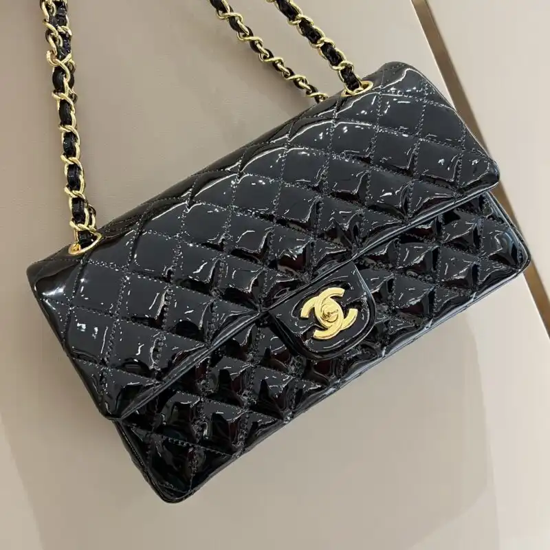 Discover the timeless elegance of the CHANEL Classic Flap 25cm in Patent Black. A perfect blend of sophistication and charm. 🖤✨💕 https://tinyurl.com/258y6ylt