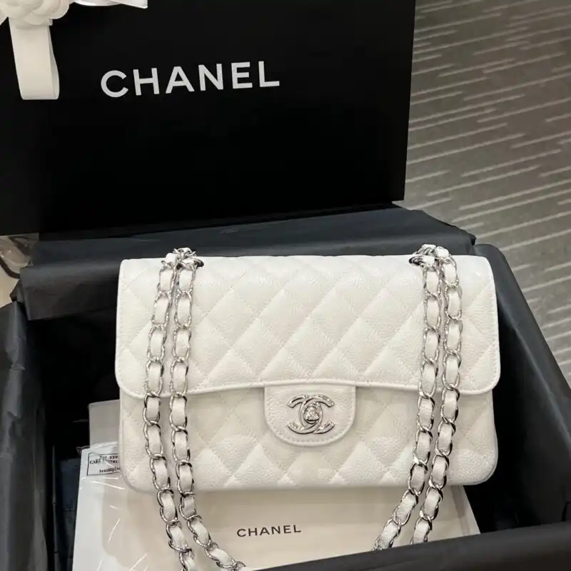 Elevate your style with the CHANEL Classic Flap 23cm in elegant white and silver. A timeless treasure for every occasion! ✨💖👜 https://tinyurl.com/25qbhav3