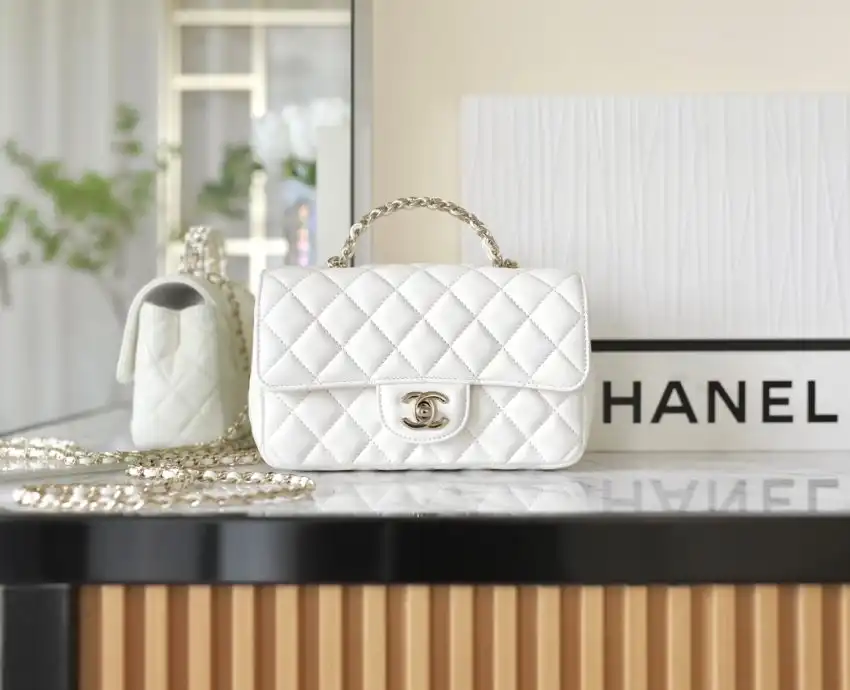 Discover the elegance of the CHANEL CF 20 cm Handle in a lovely white hue. A timeless piece to cherish! ✨👜❤️ https://tinyurl.com/24eteoxz