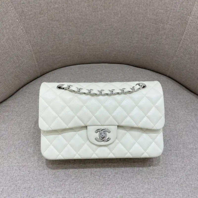 Discover the timeless elegance of the CHANEL Classic Flap 23cm in White. A perfect blend of luxury and charm. ✨🤍👜 https://tinyurl.com/296bpy6d