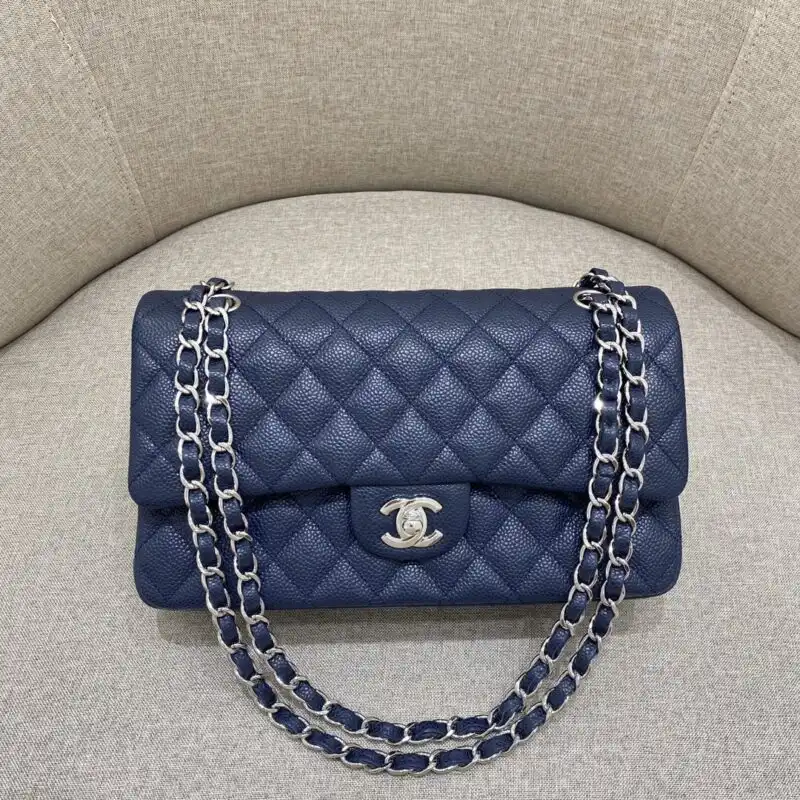 Discover the elegance of the CHANEL Classic Flap 25cm in Sea Blue. A timeless beauty that adds charm to every outfit. 💙✨👜 https://tinyurl.com/269829ar