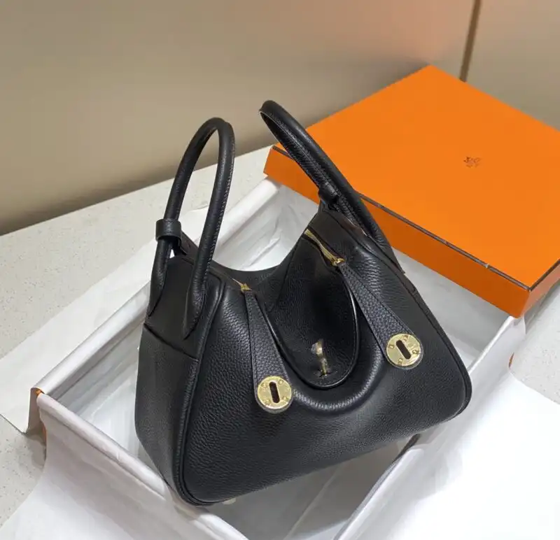 Discover the elegance of the Hermes Lindy in timeless black. A perfect blend of style and grace for any occasion. 💖👜✨ https://tinyurl.com/29jkcedg