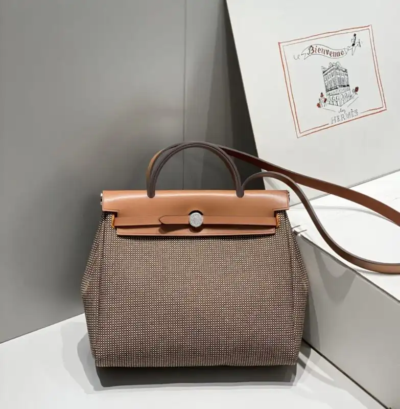Introducing the charming Hermes Herbag 31cm in lovely brown plaid. A perfect blend of elegance and versatility for everyday bliss. 👜✨💖 https://tinyurl.com/26znje3k