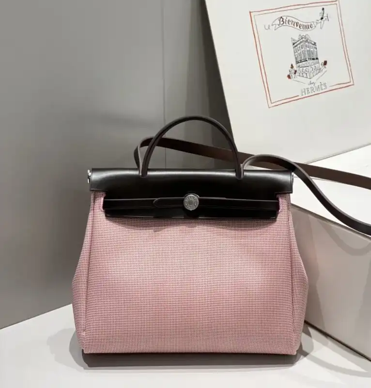 Discover the elegance of the Hermes Herbag 31cm in soft pink. A perfect blend of style and charm for every occasion! 💖✨👜 https://tinyurl.com/2c5azaxg