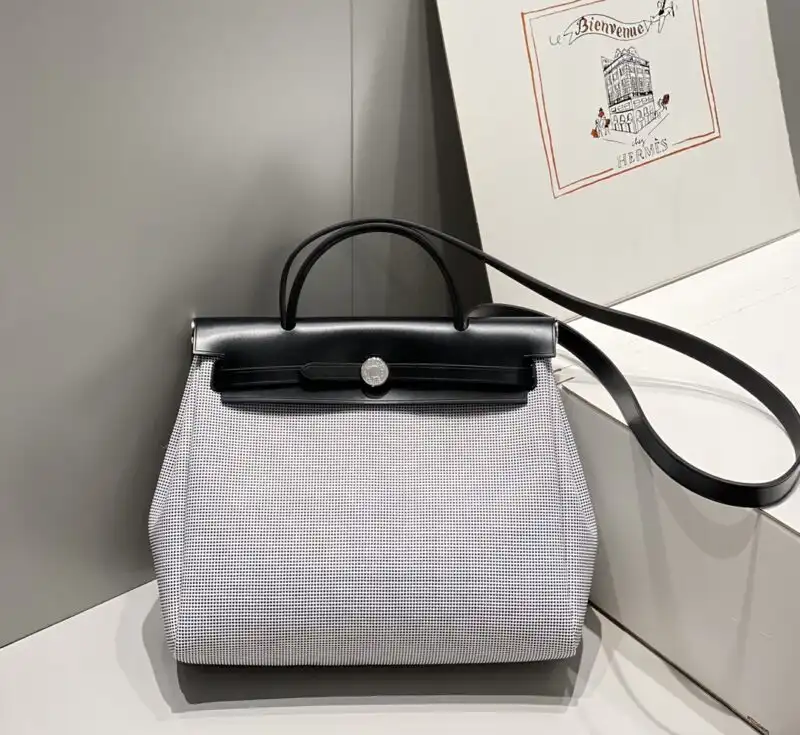 Discover the elegance of the Hermes Herbag 31cm in pristine white. A timeless companion for your everyday adventures. ✨👜💖 https://tinyurl.com/27ufchg6