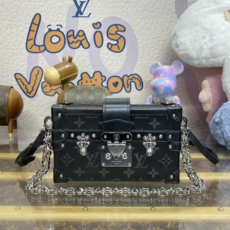 Discover the elegance of the Louis Vuitton Petite Malle in classic black. A timeless piece that adds charm to any outfit. ✨👜❤️ https://tinyurl.com/2ajbkwet