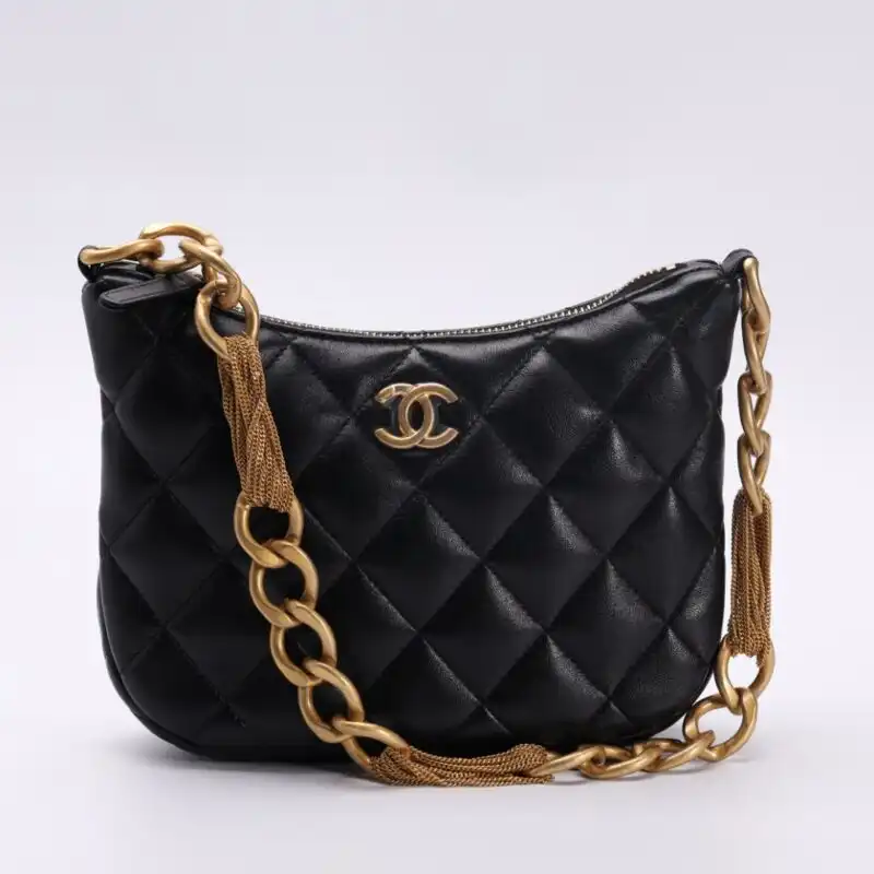Discover elegance with the CHANEL Chain Hobo in classic black. A timeless piece that complements your style beautifully. ✨🖤✨ https://tinyurl.com/2ac35zrs