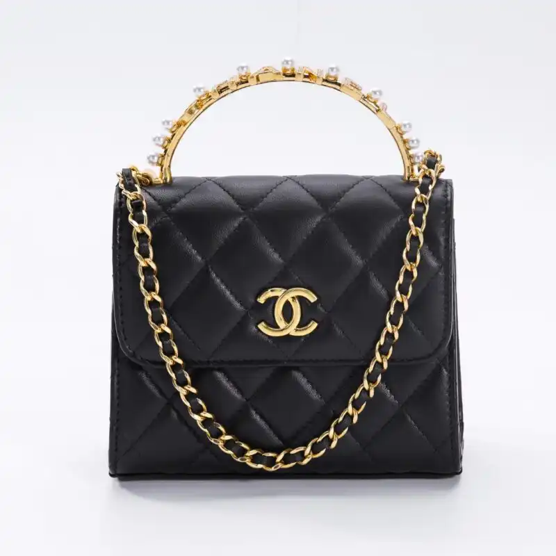 Embrace elegance with the CHANEL 23B Pearl Black Handle Bag. A timeless accessory that adds a touch of luxury to any outfit. ✨👜❤️ https://tinyurl.com/22j65ypd