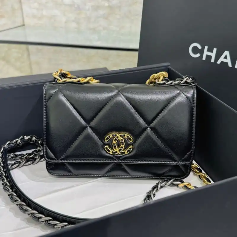 Discover elegance with the CHANEL 19 Wallet on Chain in timeless black. A perfect companion for any occasion! 🖤✨👜 https://tinyurl.com/289q2plc