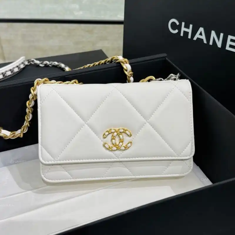 Discover the elegance of the CHANEL 19 Wallet on Chain in delicate white. Perfect for every occasion, it adds a touch of grace. 🌸✨👜 https://tinyurl.com/28kkobg4