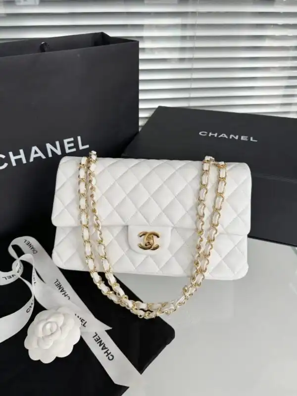 Discover elegance with the CHANEL Classic Flap 25cm in pristine white. A timeless piece that embodies grace and sophistication. ✨🤍🌸 https://tinyurl.com/29hukbsk