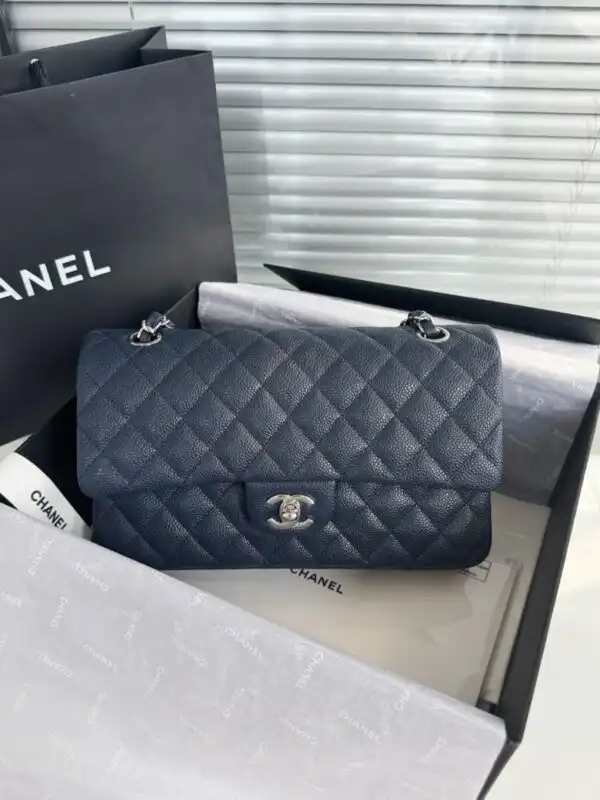 Embrace elegance with the CHANEL Classic Flap 25cm in Dark Blue. A timeless piece that adds charm to any outfit. 💙✨🥰 https://tinyurl.com/2dbv5jrt