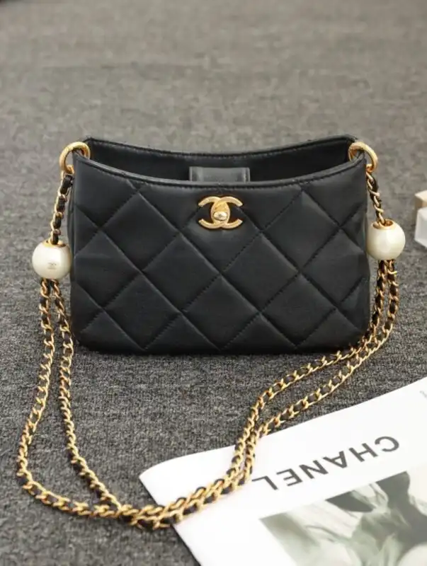 Discover the elegance of the CHANEL 24s Double Pearl Hobo Bag. A timeless accessory that adds a touch of grace to any outfit. ✨👜💖 https://tinyurl.com/2dchucc7