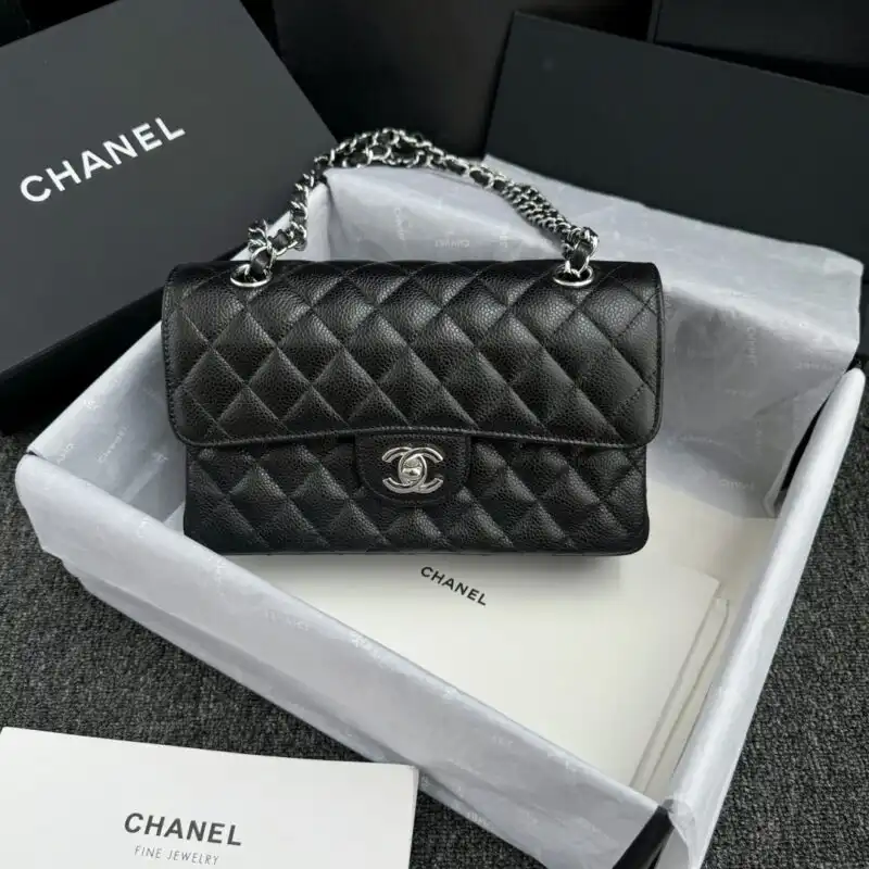 Discover the timeless elegance of the CHANEL Classic Flap in 23cm black with silver hardware. A perfect companion for any occasion! 🖤✨👜 https://tinyurl.com/24yy6mkh
