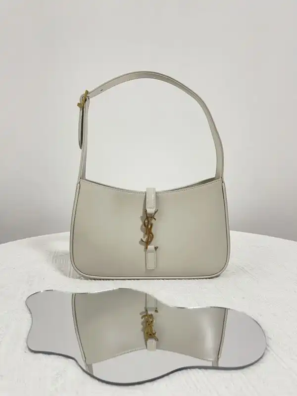 Introducing the YSL LE 5 A 7 Hobo: a timeless companion that effortlessly blends elegance and ease.✨👜 Embrace chic simplicity! 💖🌼 https://tinyurl.com/273kpzq4