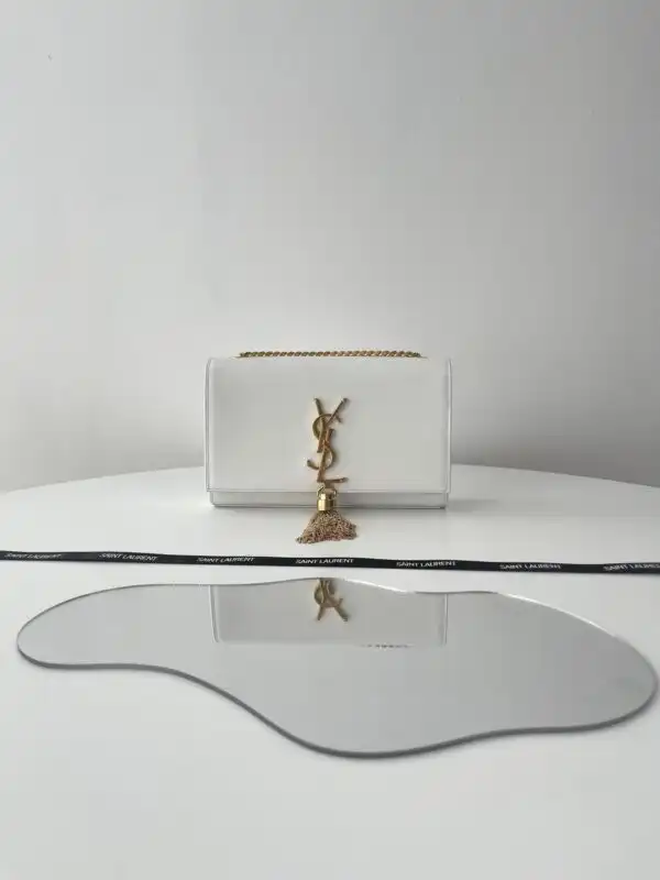 Discover the elegance of the YSL Kate Tassel White. Perfect for any occasion, it adds a touch of grace to your style. ✨💖👜 https://tinyurl.com/26c6egyg