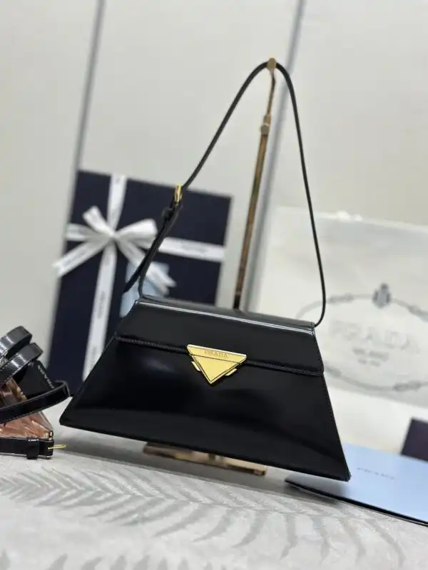Discover the elegance of the Prada Triangle Leather Handbag in timeless black. A perfect blend of style and sophistication! 🖤✨👜 https://tinyurl.com/27bdvacj