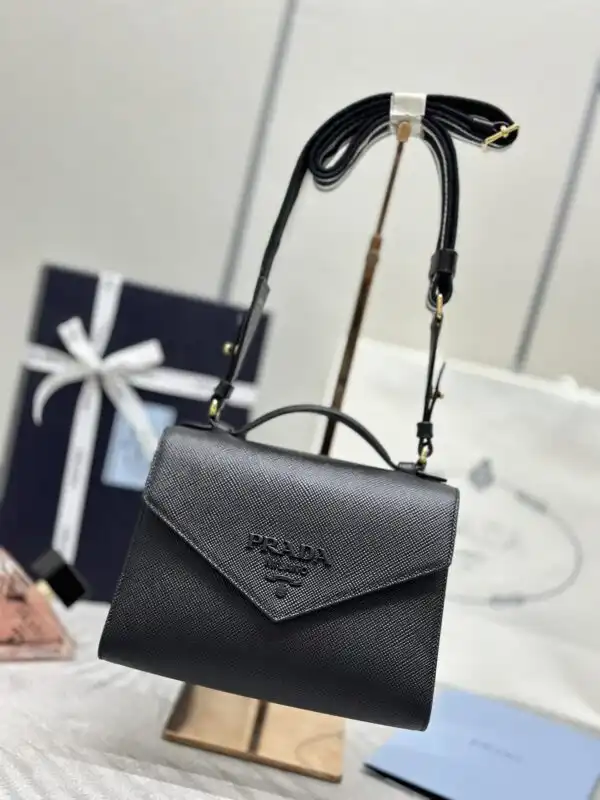 Discover elegance with the Prada Saffiano Black Envelope. A timeless piece that adds a touch of luxury to every outfit. 🖤✨👜 https://tinyurl.com/28fhn4me