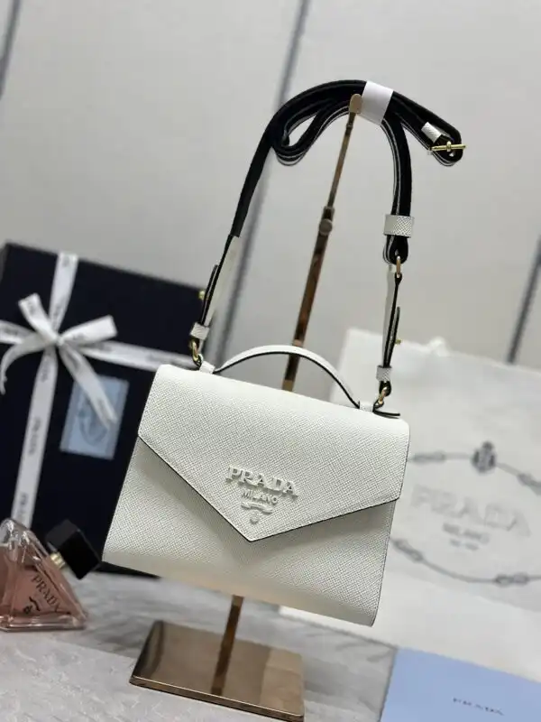 Discover elegance with the Prada Saffiano White Envelope. A timeless accessory that adds a touch of luxury to any outfit. ✨🤍👜 https://tinyurl.com/28vuurds