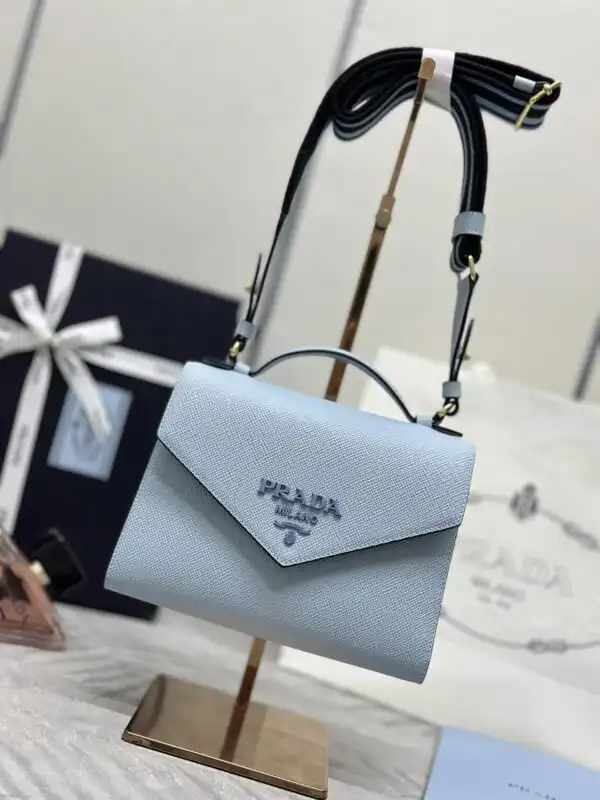 Discover the elegance of the Prada Saffiano Blue Envelope, a timeless accessory that adds a touch of charm to any outfit. 💙✨👜 https://tinyurl.com/29owqjur