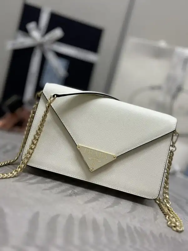 Elevate your style with the Prada Saffiano White Small Envelope. Timeless elegance meets charm—perfect for any occasion! ✨🤍👜 https://tinyurl.com/2dd8frgb