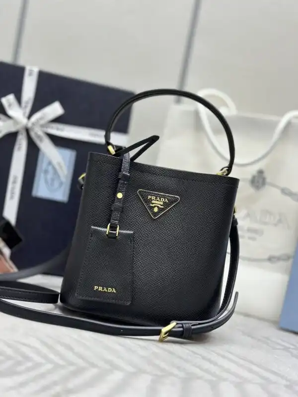 Discover elegance with the Prada Saffiano Black Bucket Bag. Timeless style meets luxury for every occasion. Treat yourself! 🖤✨👛 https://tinyurl.com/279bgarn