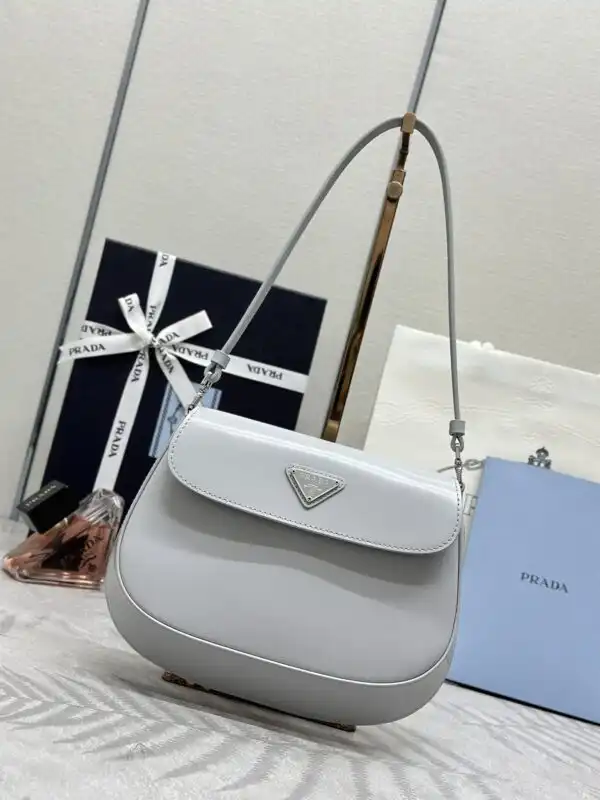 Introducing the elegant Prada Cleo Small Grey Flap – a timeless accessory that adds a touch of sophistication to any outfit. 💖✨👜 https://tinyurl.com/26guznhp