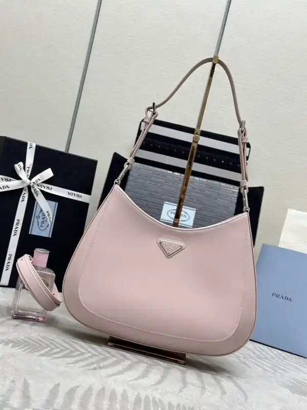 Embrace elegance with the Prada Cleo Brushed Pink Bag 🌸✨. A perfect blend of style and charm, it’s a delightful addition to your collection! 💖👜 https://tinyurl.com/285usocs